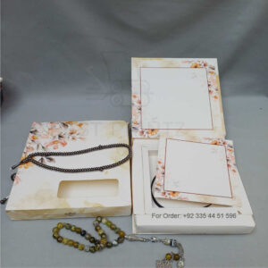 ornate white wedding invitation with embossed floral patterns (copy)