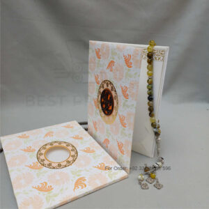 ornate white wedding invitation with embossed floral patterns (copy)