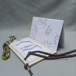 ornate white wedding invitation with embossed floral patterns (copy)