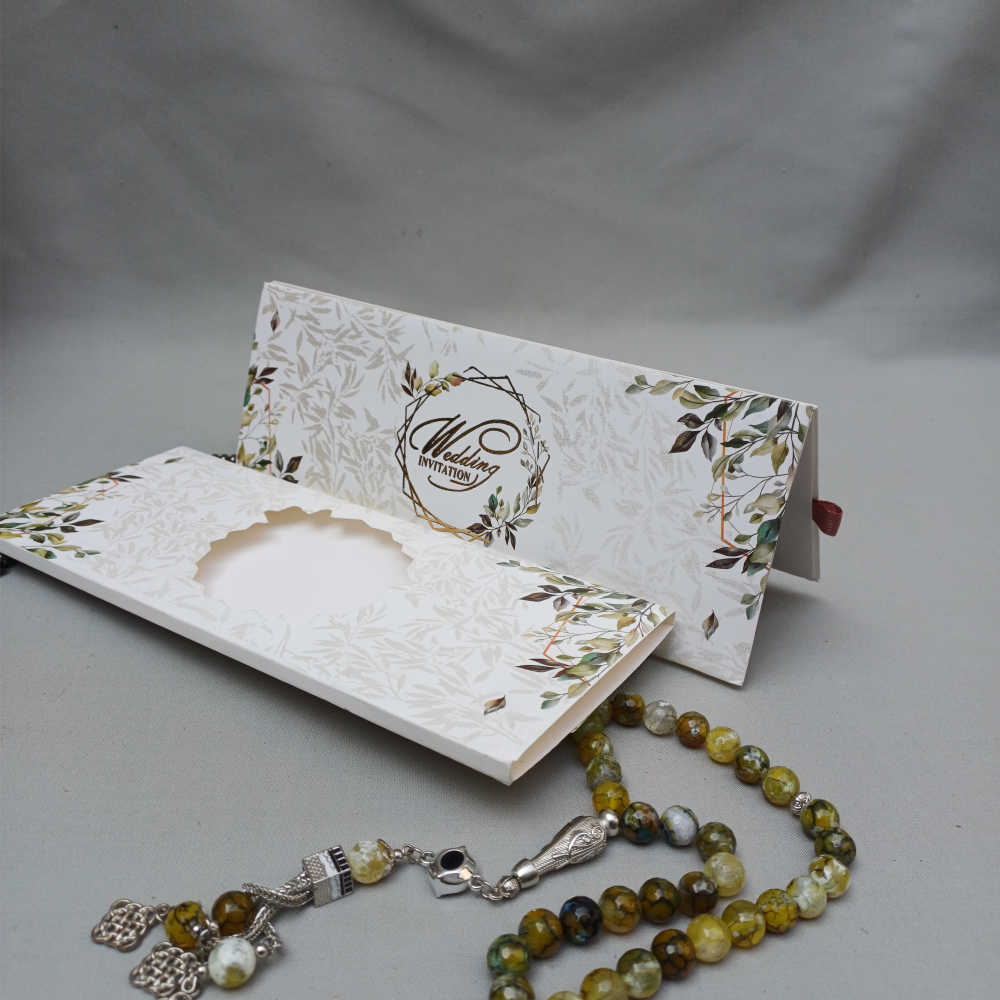 ornate white wedding invitation with embossed floral patterns (copy) ornate white wedding invitation with embossed floral patterns (copy)