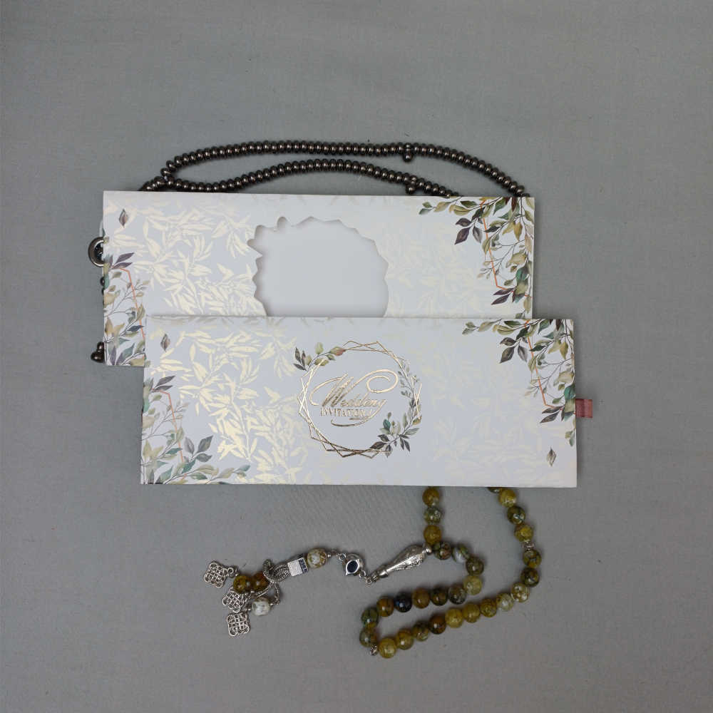 ornate white wedding invitation with embossed floral patterns (copy) ornate white wedding invitation with embossed floral patterns (copy)