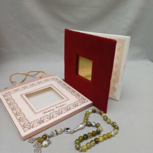 ornate white wedding invitation with embossed floral patterns (copy)