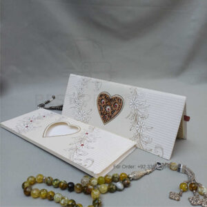 ornate white wedding invitation with embossed floral patterns (copy)