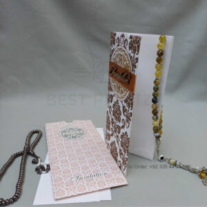 ornate white wedding invitation with embossed floral patterns (copy)