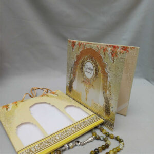 ornate white wedding invitation with embossed floral patterns (copy)