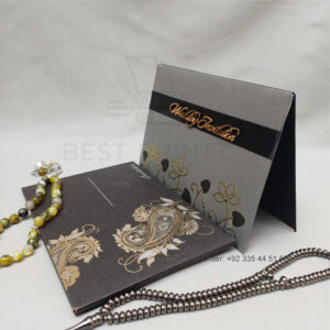 ornate white wedding invitation with embossed floral patterns (copy)