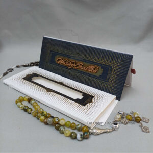 ornate white wedding invitation with embossed floral patterns (copy)