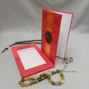 ornate white wedding invitation with embossed floral patterns (copy)