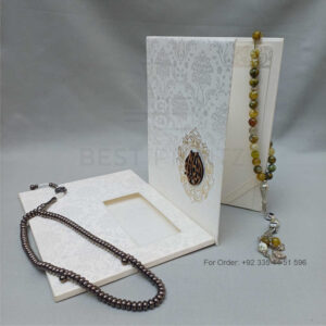 ornate white wedding invitation with embossed floral patterns (copy)