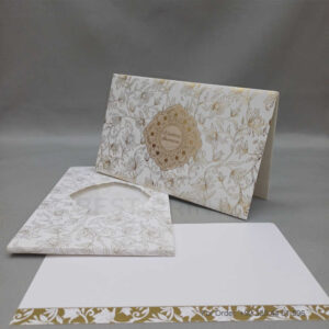 a white envelope containing a wedding invitation card tied with a string (copy)