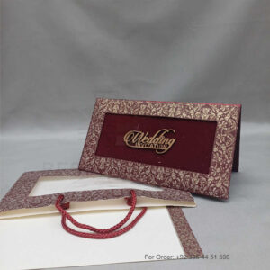 a white envelope containing a wedding invitation card tied with a string (copy)