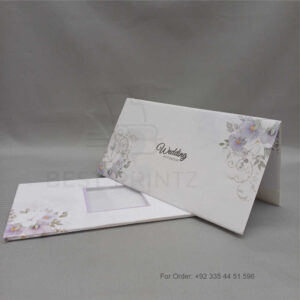 a white envelope containing a wedding invitation card tied with a string (copy)