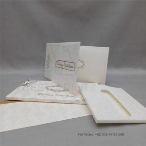 a white envelope containing a wedding invitation card tied with a string (copy)