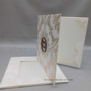 a white envelope containing a wedding invitation card tied with a string (copy)