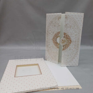 a white envelope containing a wedding invitation card tied with a string (copy)