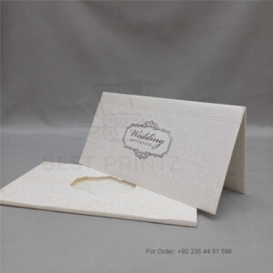 a white envelope containing a wedding invitation card tied with a string (copy)