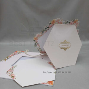 a white envelope containing a wedding invitation card tied with a string (copy)