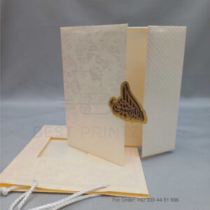 a white envelope containing a wedding invitation card tied with a string (copy)