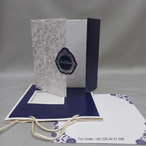 a white envelope containing a wedding invitation card tied with a string (copy)